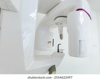 Close up view of a cbct scanner positioned in a bright, sterile dental clinic, prepared for an upcoming dental scan