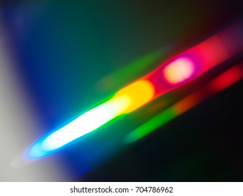 Close up view of CD reflection multicolor light spectrum