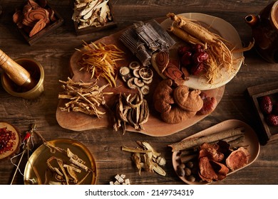 Close View Of Chinese Traditional Herb Ginseng Mushroom In Wooden Table 