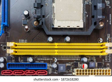 Close up view of chipset or am2 socket with ram and pci express slot on old computer motherboard.