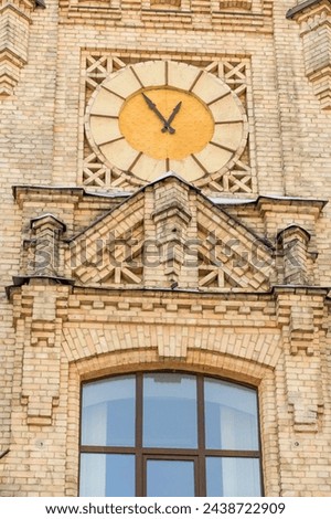 It's a close up view of clock on main building of National Technical University of Ukraine. Its photo of Igor Sikorsky Kyiv Polytechnic Institute. 