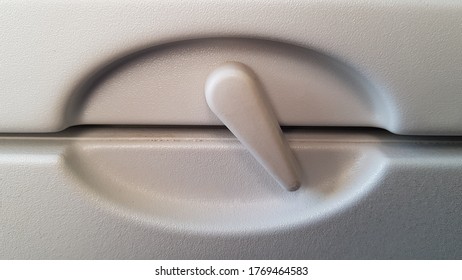 Close View Of The Closed Food Tray In Front Of The Seat Of A Passenger Plane