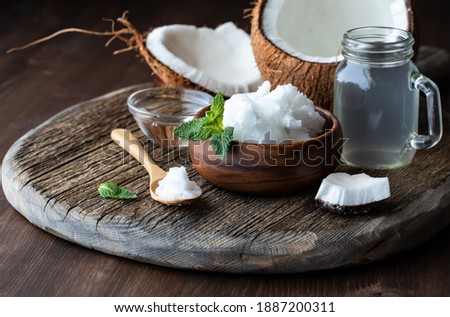 Similar – Image, Stock Photo Coconut oil in wooden bowl with spoon and moisturizing cream