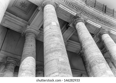 Close view of the colums of the Saint Peter's square in Vatican in black and white, Rome, Italy