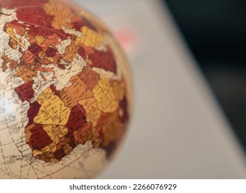 Close up view of the continent of Africa and Europe on a globe on a gray background. - Shutterstock ID 2266076929