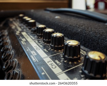 Close up view of control panel ofkeyboard amplifier, swlwctive focus.