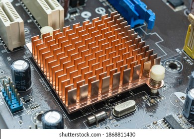 Close up view of copper heat sink or radiator on computer motherboard. Close up and side view.