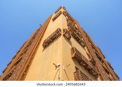 Close up view of the corner of building from bottom to top in the old city of Jeddah, Saudi Arabia, at daytime 