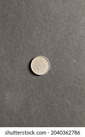 Close View Of Counterfeit Coin