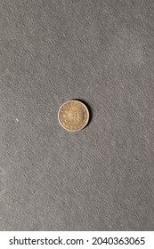 Close View Of Counterfeit Coin