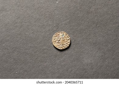 Close View Of Counterfeit Coin