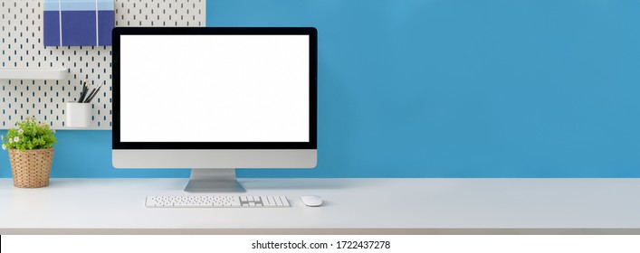 Close up view of creative workspace with blank screen computer, supplies and copy space on white table with shelf on light blue wall - Powered by Shutterstock