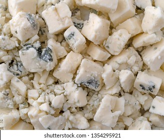 Close View Of Crumbled Blue Cheese Illuminated With Natural Lighting.