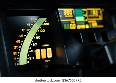 Close up view of a digital speedometer in a vintage car