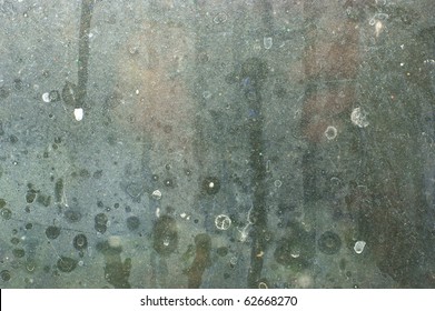 Close View Of A Distinctly Dirty Window Showing Grit, Grime, Streaks And Opacity.