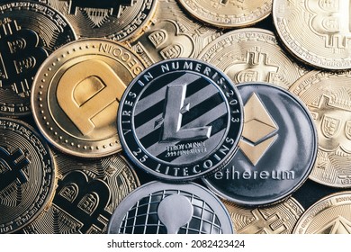 Close Up View Of Dodge Coin, Ripple, Litecoin And Ethereum Surrounded By Bunch Of Bitcoins. Macro, Financial Concept Of Shiny Cryptocurrencies.