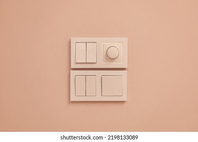 Close Up View Of Electric Light Switch On Pale Pink Wall