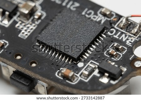 close up view of electronic component, integrated circuit on a circuit board.