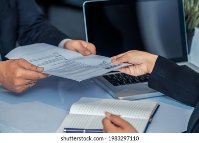 Close up view of employee candidate hands CV resume document to the interviewer HR human resources department manager at the interview room. Job application, recruit and labor hiring concept. - Shutterstock ID 1983297110