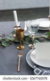 close up view of empty card on plates on tabletop with beautiful rustic setting for guests