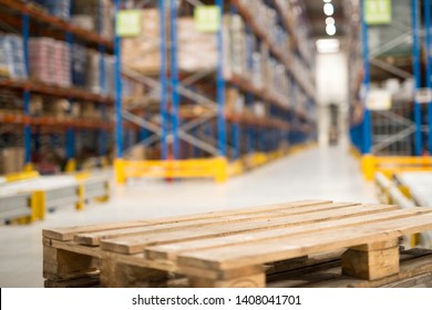 Close Up View Of An Empty Palette In Large Warehouse Facility. Distribution Warehouse Center With Copy Space.