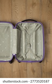Close view of empty suitcase interior showing minimal travel packing preparation.