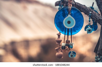 Close up view of evil eye amulet on mountain background in Cappadocia, Turkey