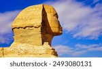 Close up view of the face of the Great Sphinx of Giza,said to resemble Pharaoh Khafre with its damaged nose on a bright sunny day on the Giza plateau near Cairo,Egypt