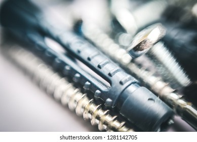 Close up view fastening elements bolts  nails  screws  washers  confirmats  dowels blurred the top   bottom photo   Blurred background   selective focus 