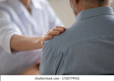 Close up view of female professional doctor, nurse or caregiver hand touching shoulder of senior elder old male patient expressing trust, support. Elderly people medical health care, medicare concept. - Shutterstock ID 1720779931