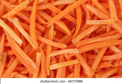 A Close View Of Finely Cut Shredded Carrot Sticks.