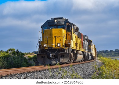 Up close view of a freight train going around a corner