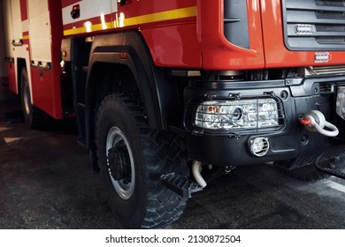 Close up view of front part of red fire truck. Natural lighting. - Shutterstock ID 2130872504
