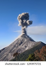 Close view of Fuego volcano eruption, molten rocks, hot ash, gas and smoke belched up from the crater during explosion. Acatenango volcano trek. Natural disaster in Guatemala, Central America.