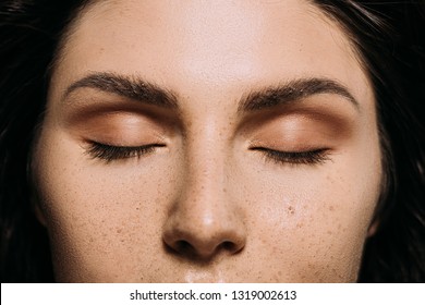 Close Up View Of Girl With Closed Eyes And Freckles On Face 