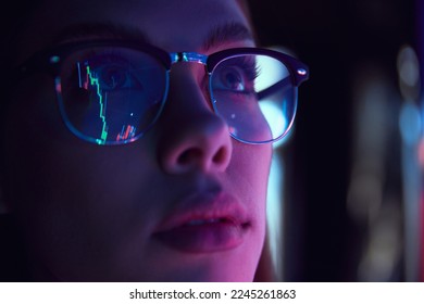 Close up view of girl's eyes in glasses looking at pc screen with computer reflection at eyewear. Using internet, working online, AI, business. Concept of modern technologies, career development - Powered by Shutterstock