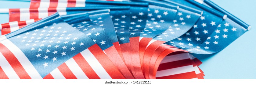 close up view of glossy american flags, panoramic shot - Shutterstock ID 1412313113