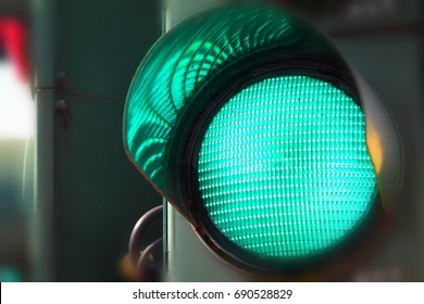 Close Up View Of Green Color On The Traffic Light.