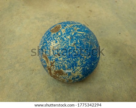 Close up view of a hammer throw ball on a cement floor