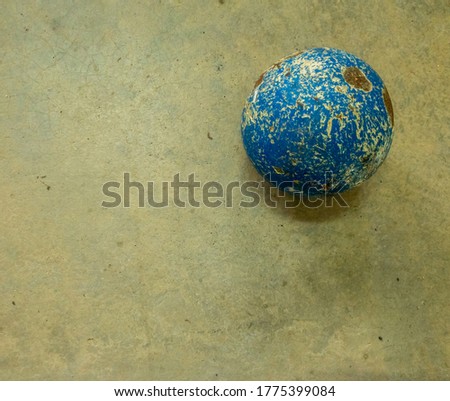 Close up view of hammer throw ball on a cement floor