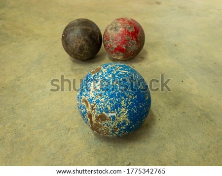 Close up view of hammer throw balls on a cement floor