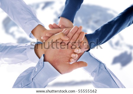 Close up view of hands getting together in office environment