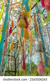 close up view of hanging from above colorful tassels and ribbons
