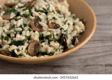 Close up view of homemade lemon risotto with spinach and portobello mushroom. Healthy lifestyle concpt. - Powered by Shutterstock