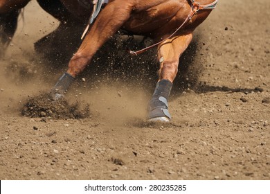 A close up view of a horse running in dirt.