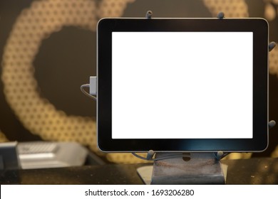 Close Up View Of Hotel Reception Desk White Blank Screen Information Panel With Blurry Background.