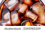Close up view of the ice cubes in dark cola background. Texture of cooling sweet summer
