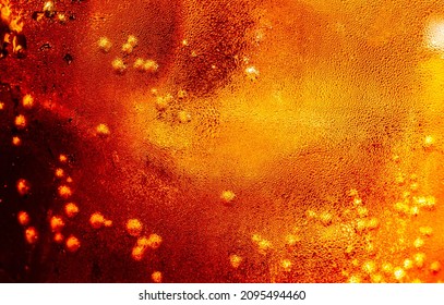 Close up view of the ice cubes in dark cola background. Texture of cooling sweet summer's drink with foam and macro bubbles on the glass wall. Fizzing or floating up to top of surface - Shutterstock ID 2095494460