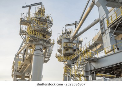 A close up view of an industrial crane structure, showing the intricate details and robust construction of heavy machinery used in transportation and logistics. - Powered by Shutterstock