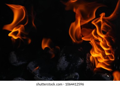 Close Up View Inside The Bbq Grill On Burning Open Fire With Red Flame, Hot  Charcoal Briquettes And Embers. Abstract Background And Natural Texture